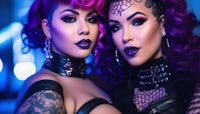 two women with purple hair posing for a photo